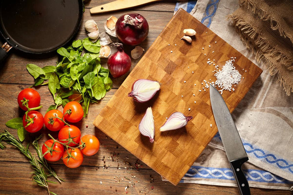 Why is a Wet Towel Placed Under the Cutting Board When Cutting Onions?