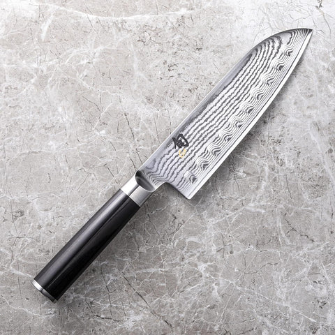 Image of Classic 7” Hollow-Ground Santoku All-Purpose Kitchen Knife; VG-MAX Blade Steel and Ebony Pakkawood Handle; Hollow-Ground Indentations for Reduced Friction and Smoother Cuts; Handcrafted in Japan